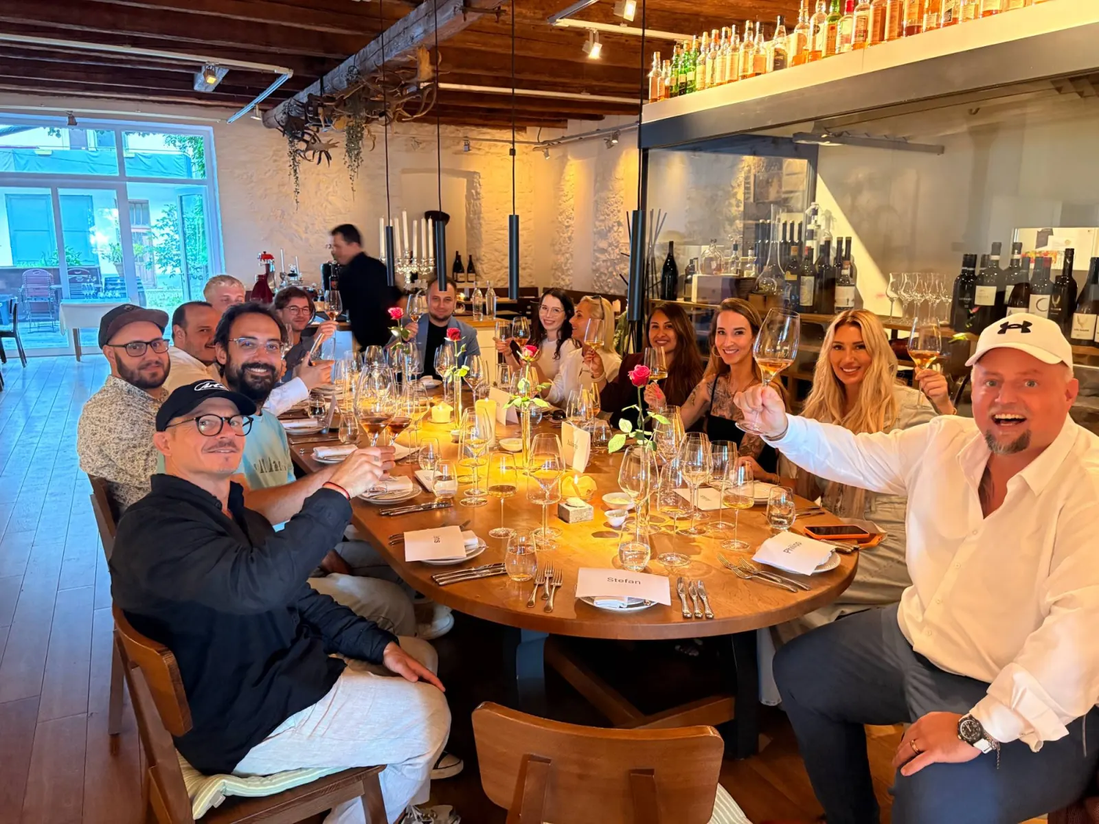 SIROC partners raising a glass at a long-table dinner